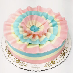Pink and blue ribbon gender reveal cake