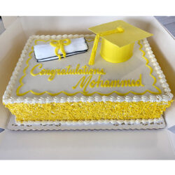 Graduation cake with 3d cap and piped diploma