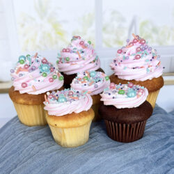 Mother's Day Tinted icing and pearl sprinkle cupcakes.